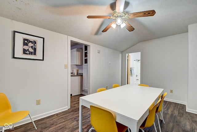 dining area with dark wood-style floors, ceiling fan, lofted ceiling, and baseboards