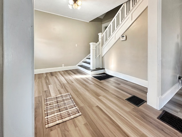 stairway featuring wood-type flooring