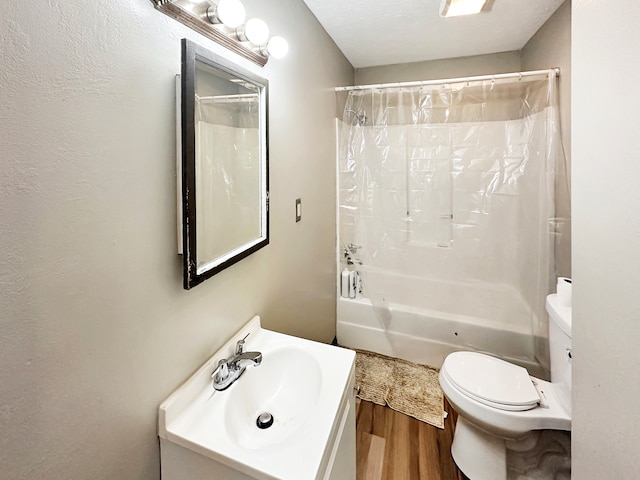 full bathroom featuring vanity, toilet, hardwood / wood-style floors, and shower / bath combination with curtain