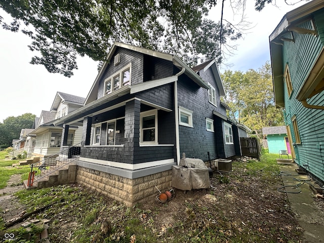 exterior space with a porch and central AC