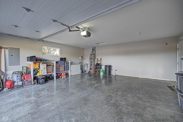 310 Jefferson, Coatesville, IN 46121 - garage with electric panel and a garage door opener