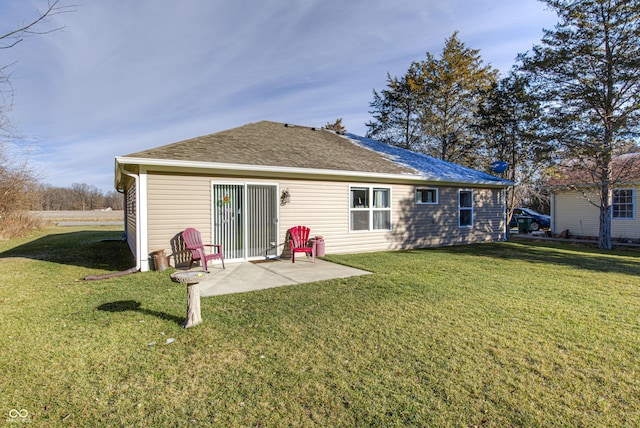 310 Jefferson, Coatesville, IN 46121 - back of house featuring a yard, a shingled roof, and a patio