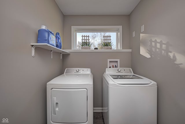 laundry room with separate washer and dryer