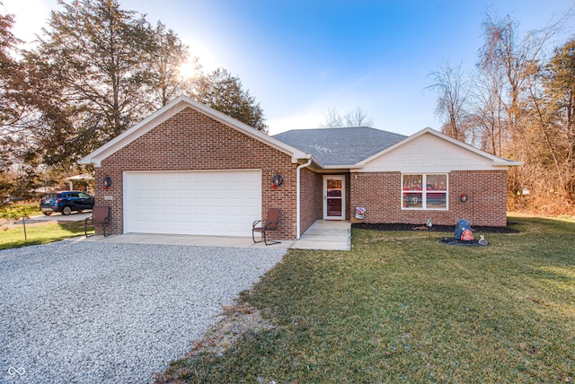 ranch-style home with a garage and a front yard