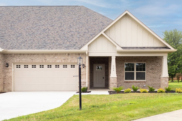 craftsman-style home featuring a front yard and a garage