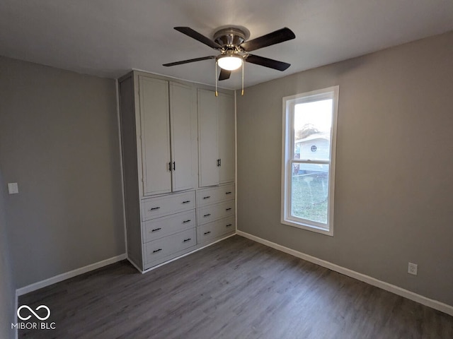 unfurnished bedroom featuring wood-type flooring and ceiling fan