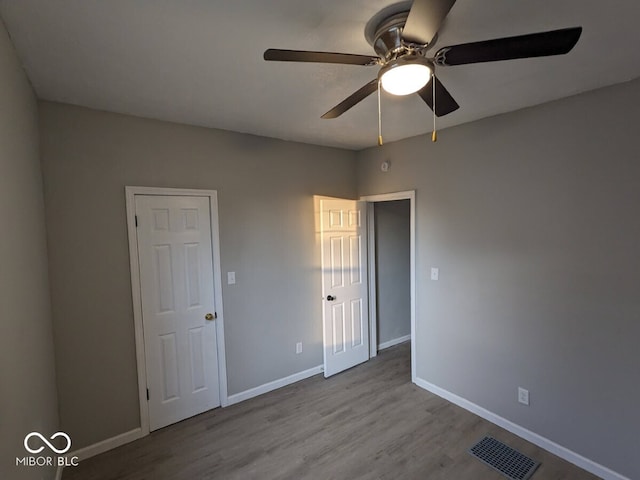 unfurnished room featuring light hardwood / wood-style flooring and ceiling fan