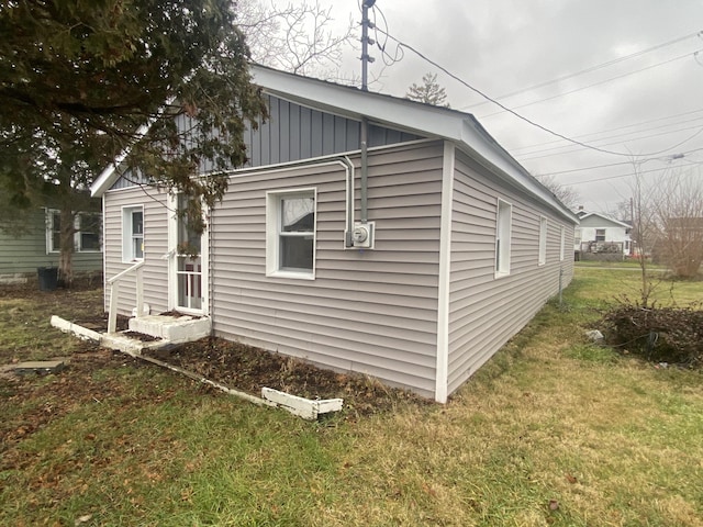 view of home's exterior with a lawn