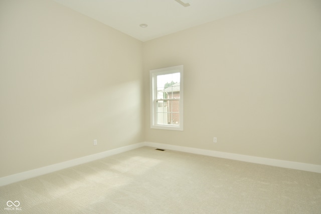 unfurnished room with light colored carpet