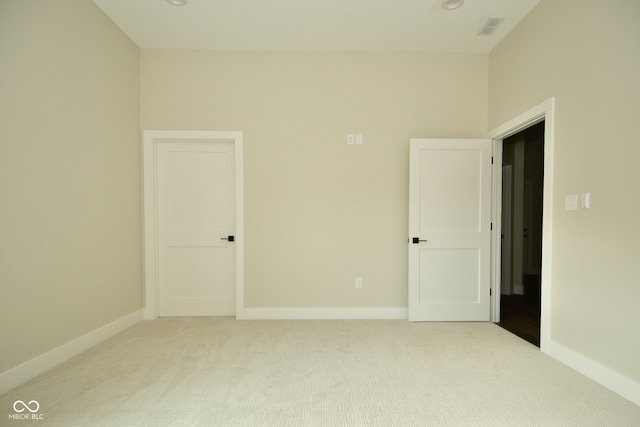 empty room with light colored carpet