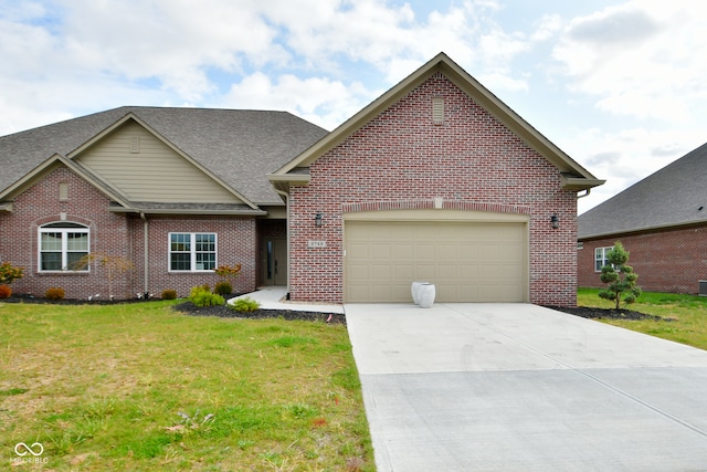 view of front of home featuring a garage and a front yard