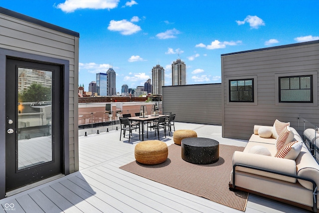 wooden terrace featuring outdoor lounge area