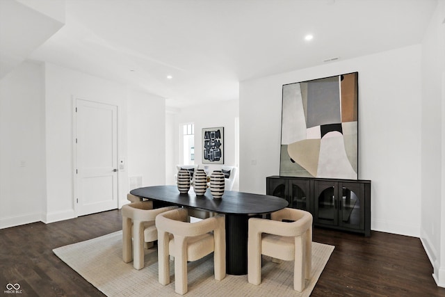 dining room featuring dark hardwood / wood-style flooring