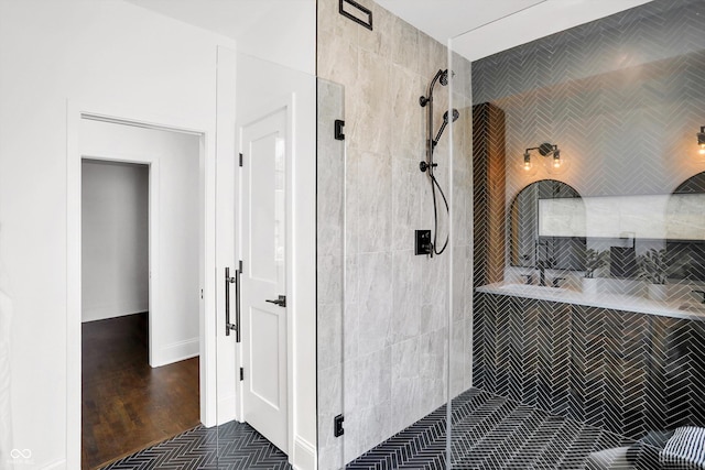 bathroom with tiled shower