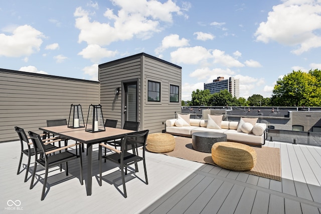 wooden terrace featuring an outdoor hangout area