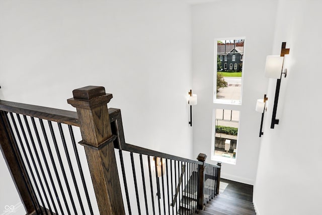 stairs with hardwood / wood-style floors