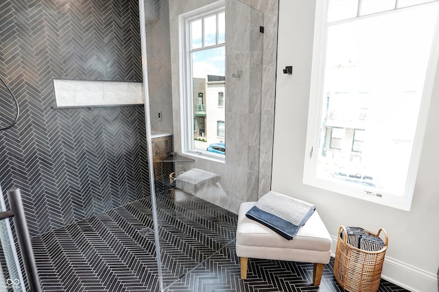 bathroom with plenty of natural light and walk in shower