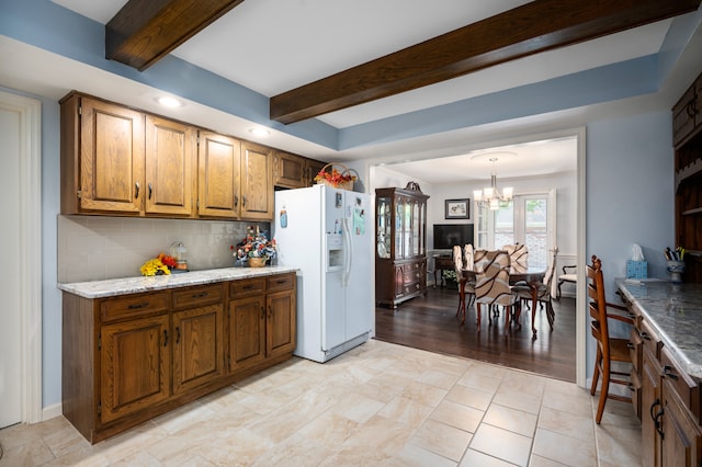 kitchen featuring white refrigerator with ice dispenser, light hardwood / wood-style flooring, decorative backsplash, a notable chandelier, and beam ceiling