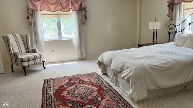 bedroom with light colored carpet