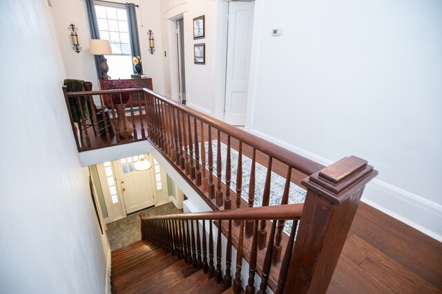 staircase featuring hardwood / wood-style flooring