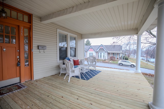 wooden terrace with a porch