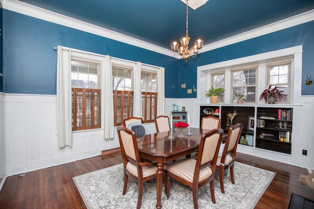 dining room featuring plenty of natural light, dark hardwood / wood-style floors, and ornamental molding