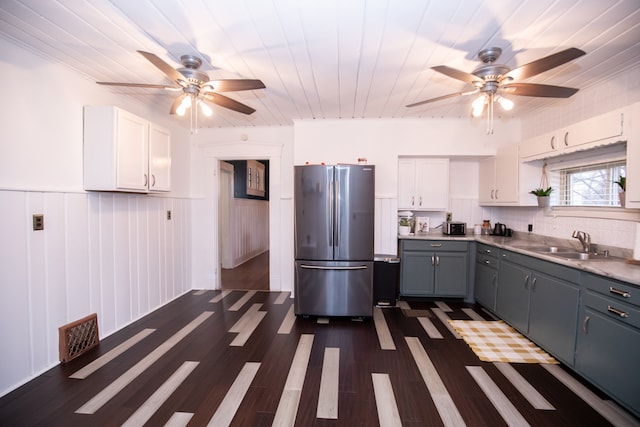 kitchen with white cabinets, sink, stainless steel fridge, wooden ceiling, and gray cabinetry