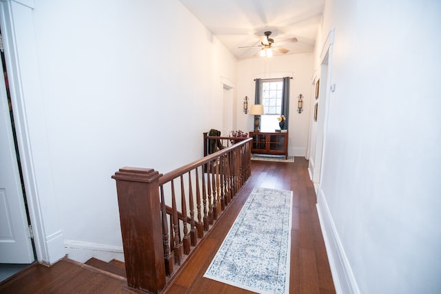 corridor featuring dark hardwood / wood-style floors