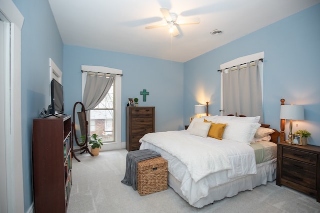 carpeted bedroom featuring ceiling fan