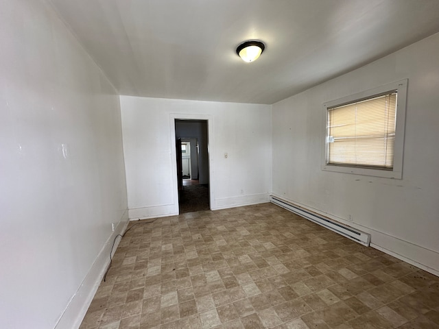 unfurnished room featuring a baseboard radiator and light tile floors