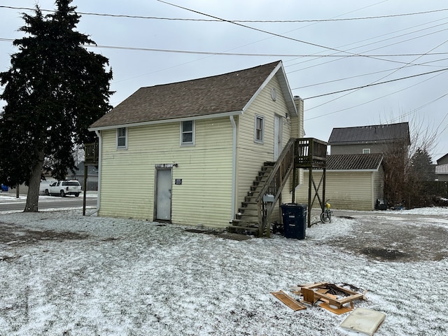 view of snow covered house