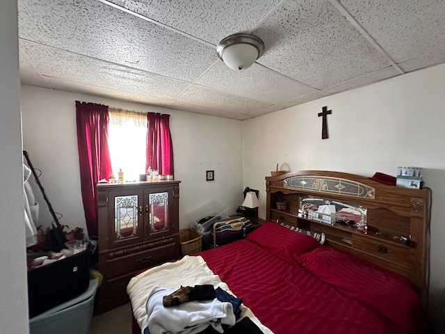 bedroom with a paneled ceiling