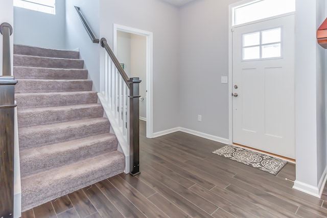 entrance foyer with dark hardwood / wood-style floors