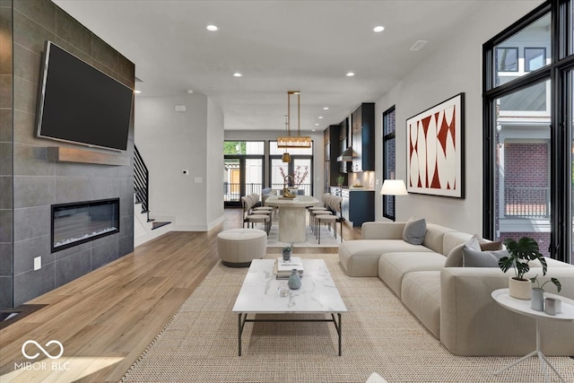 living room featuring light hardwood / wood-style flooring and a fireplace