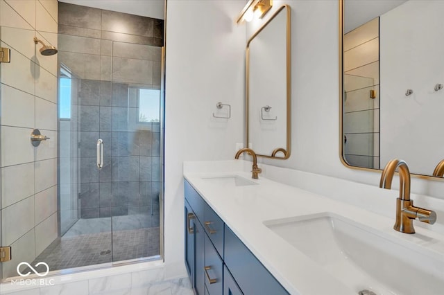 bathroom with vanity and a shower with door