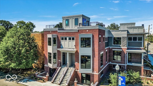 back of house with a balcony