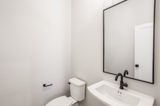 bathroom with sink and toilet