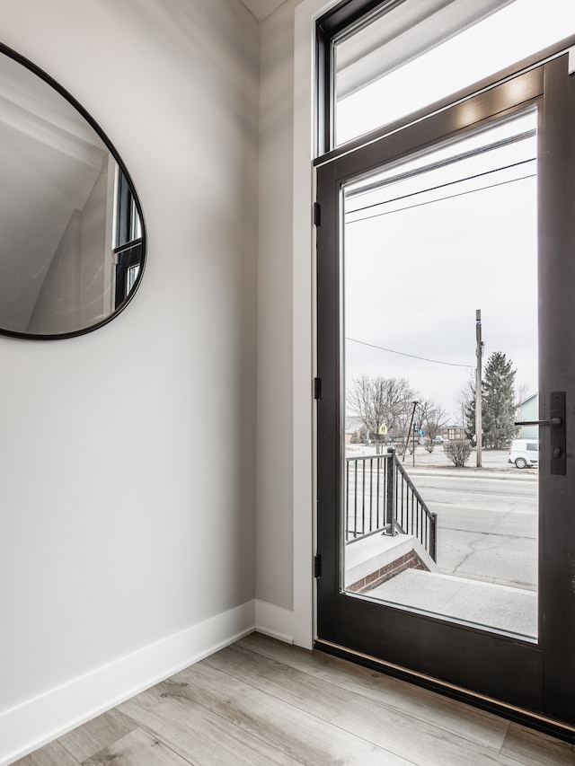 doorway to outside featuring light wood-type flooring