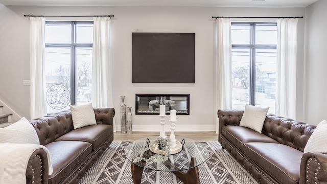 living room featuring a wealth of natural light and hardwood / wood-style floors