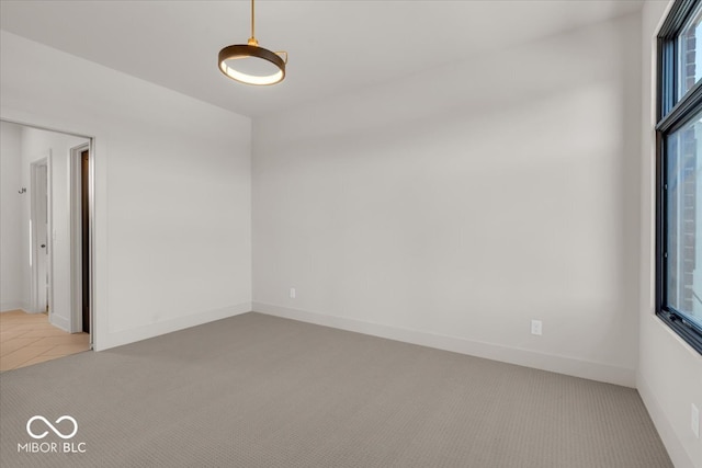 unfurnished room with carpet flooring