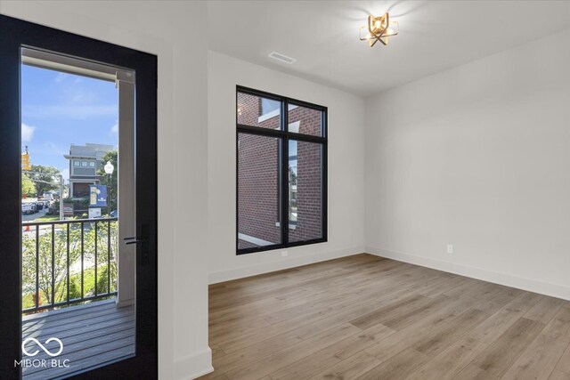 empty room with wood-type flooring