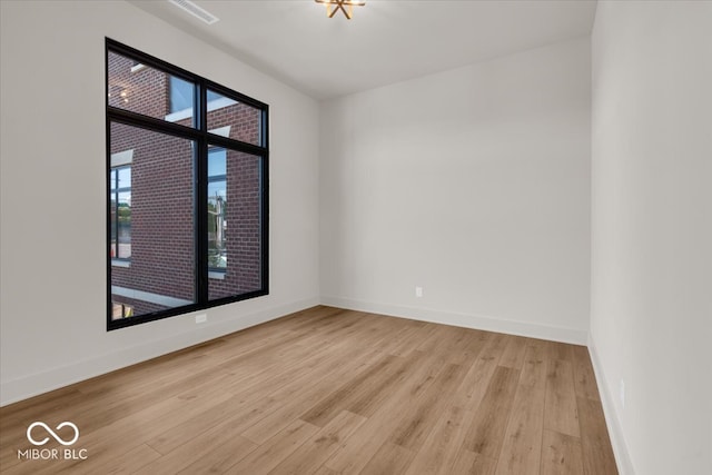 unfurnished room featuring light hardwood / wood-style floors