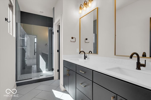 bathroom featuring vanity, tile patterned flooring, and a shower with door