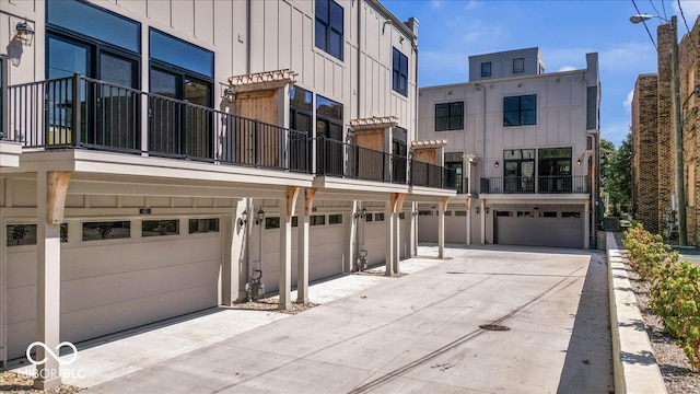 exterior space featuring a balcony and a garage