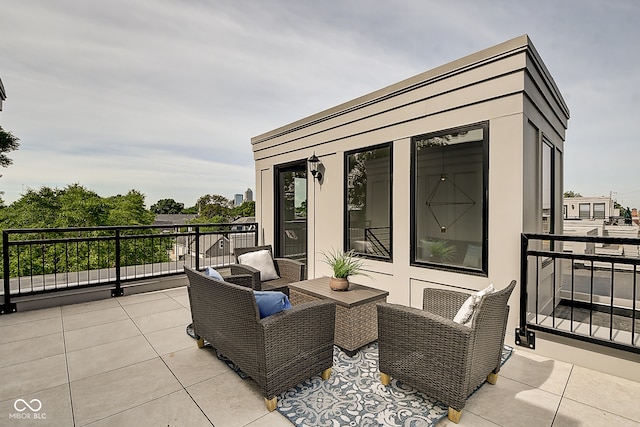 view of patio / terrace with a balcony