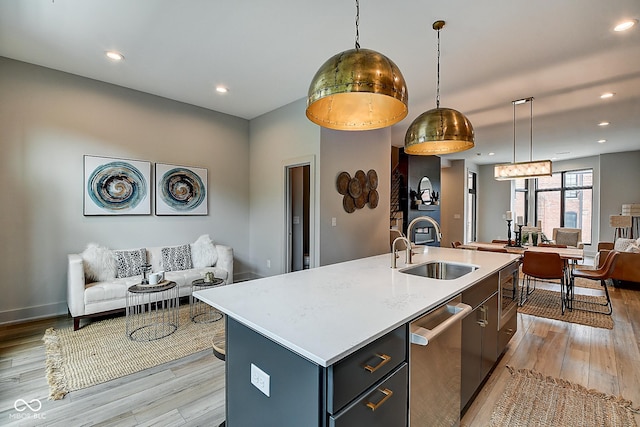 kitchen with a kitchen island with sink, open floor plan, and dishwasher