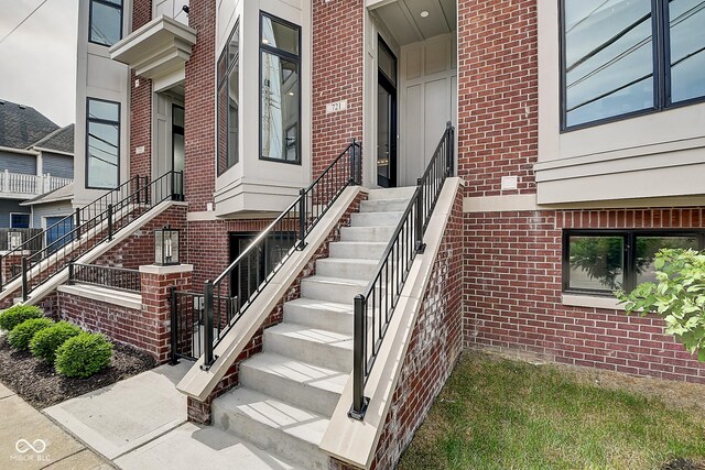 entrance to property with brick siding