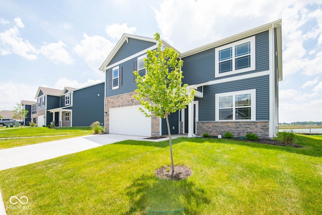 view of front of house featuring a garage and a front yard