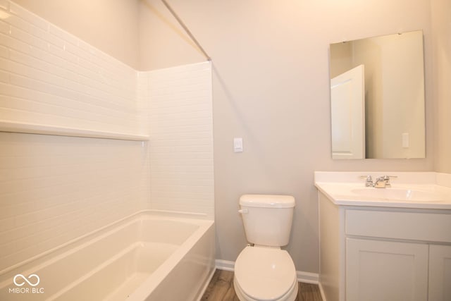 full bathroom with hardwood / wood-style flooring, vanity with extensive cabinet space, toilet, and shower / bathing tub combination