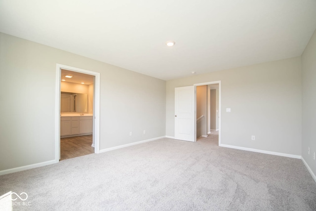 spare room with light hardwood / wood-style floors